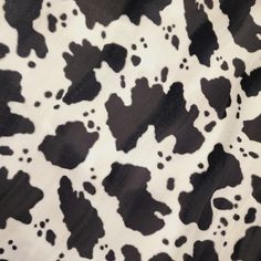 black and white cow print fabric with spots