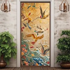 an open door with birds and flowers painted on the glass next to potted plants