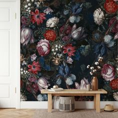 a floral wallpaper with red, white and blue flowers on a dark colored background