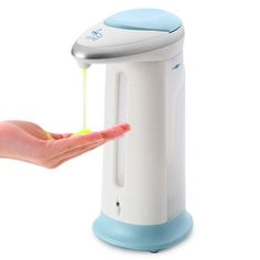 a person is holding out their hand to touch the air freshener dispenser