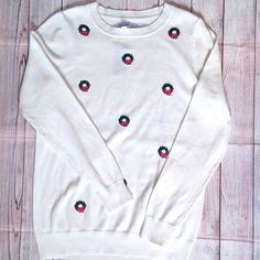 New With Tags Kim Rogers Christmas Wreath Sweater Ivory Woman's M. Fit Is Loose. Measurements Laying Flat 19.5" Pit To Pit 27.5" Length 100% Cotton White Festive Sweater For Fall, Festive White Sweater For Fall, White Holiday Festive Sweater, White Festive Holiday Sweater, Christmas White Embroidered Tops, Winter White Embroidered Tops, White Embroidered Winter Tops, White Casual Sweater For Festive Occasions, Casual White Festive Sweater