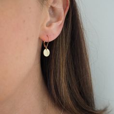 Dainty, gold filled hand stamped botanical disc earrings, paired with secure lever-back ear wires. These gold filled disc earrings are great for everyday wear with a minimalistic style they make a great gift too.  Item Details: 14k gold filled hand stamped discs (10mm diameter) 14k gold filled lever back ear wires These arrive in a sweet little gift box. Dainty Round Disc Earrings For Everyday, Dainty Everyday Round Disc Earrings, Minimalist Dangle Earrings With Birth Flower, Minimalist Birth Flower Earrings For Everyday, Stamped Earrings, Minimalistic Style, Disc Earrings, Tiny Hand, Earrings In Gold