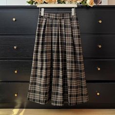 Pleated plaid midi skirt in cozy colors to go with your autumnal fits. Features an elastic waist back. Lined. One Size: 26"-36" waist, 31" length Overall Dress, Sweater Blouse, Cardigan Jacket, Autumn Summer, Black Color, Sweaters & Cardigans, Elastic Waist, Shirt Blouses, Top Shirt