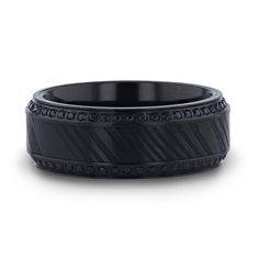 a black wedding band with an intricate design