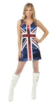 a woman in a british flag dress and boots posing for the camera with her hands on her hips