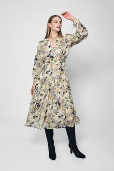 Introducing our boho style Sofia Floral Dress, a delightful and versatile piece that combines elegance with a touch of playfulness. This enchanting dress features a soothing beige pastel hue, long sleeves, and a front tie button , creating a chic and feminine look in this Lakeyo piece. Model's measurement is Height: 173cm / 5'8'' Bust: 84cm / 33'' Waist: 64cm / 25'' Hips: 89cm / 35'' - Length: Midi - Long Sleeves - Front tie waist detail - Flowy hemline - Elastic cuff design Composition: 100% Polyester Lining: 100% Polyester Please note: The Lakeyo clothing range runs half a size smaller than standard AU clothing sizes, please consider the size before purchase. Enchanting Dress, Design Composition, Cuff Design, Wool Winter Coat, Composition Design, Pastel Hues, Long Sleeve Midi, Feminine Look, Yellow Floral