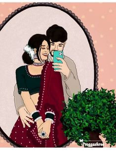 a man and woman taking a selfie in front of a mirror with a potted plant