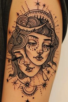 a woman's face with stars and moon tattoo on her thigh