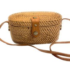 Natural Oval Rattan Handbag | Crossbody Adjustable Rectangular Natural Bag, Natural Color Adjustable Rectangular Bag, Handmade Adjustable Rectangular Shoulder Bag, Adjustable Natural Color Rectangular Shoulder Bag, Adjustable Brown Woven Shoulder Bag, Basket Shaped Rattan Shoulder Bag, Handmade Rattan Handheld Bag, Eco-friendly Rattan Shoulder Bag For Daily Use, Eco-friendly Rattan Shoulder Bag For Summer