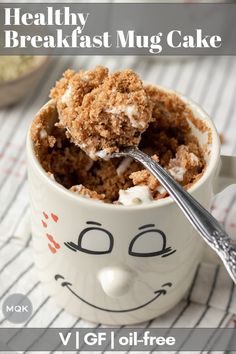 a close up of a cup of food with a spoon in it and the words healthy breakfast mug cake