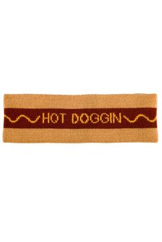 a brown and red ribbon with the words hot dogin on it's side