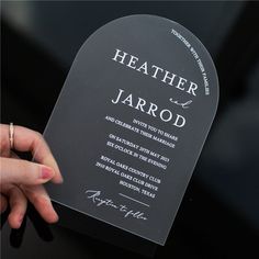 a person holding up a black and white card with the words leather jarrod written on it