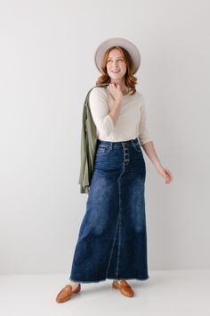 A long denim skirt so comfortable you will never want to take it off! The 'Haven' denim skirt in dark wash is made out of a stretch denim to keep you comfy wherever life takes you! This skirt has all of the vintage features you love- buttons up the front, working pockets, an A-line design, and a raw edge hem. Exclusively designed by us, for you! 95% Cotton 5% Spandex Wash Cold Gentle Cycle Hang to Dry Low Iron if Needed Model Height 5'8" | Wearing Size 2 Model Height 5'6" | Wearing Size 16 Pleas Everyday Dark Wash Denim Skirt, Dark Wash High Rise Casual Maxi Skirt, Casual High Rise Dark Wash Maxi Skirt, Everyday High-rise Denim Skirt For Fall, High Rise Dark Wash Denim Skirt For Everyday, Modest Denim Skirts, Stretch Denim Skirt, Jean Skirts, Skirts Denim