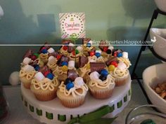 cupcakes are arranged on a cake stand