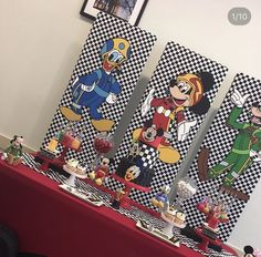 the table is covered with mickey mouse decorations