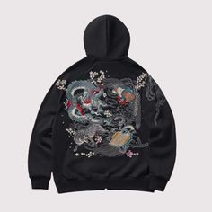 Mythic Creatures, Chic Streets: Rock the Dragon with Our New Hoodie Dive into the depth of tradition and the edge of contemporary style with our Black Japanese Hoodie. A striking emblem of cultural artistry, this hoodie features intricate embroidery that brings to life the fierce beauty of dragons, wrapped in an aura of cherry blossoms and mythical waves. Designed for those who dare to stand out, each dragon is meticulously detailed, symbolizing power, strength, and the moving force of nature, w Artistic Graphic Print Hoodie For Winter, Artistic Hooded Hoodie For Fall, Artistic Long Sleeve Hoodie For Fall, Artistic Cotton Sweatshirt For Winter, Artistic Winter Streetwear Outerwear, Artistic Winter Outerwear For Streetwear, Artistic Cotton Hooded Hoodie, Artistic Cotton Hoodie, Artistic Long Sleeve Sweatshirt For Winter