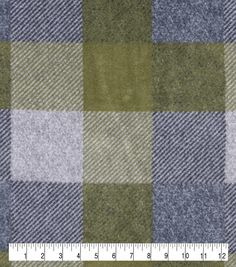 a green and grey checkered fabric with a ruler