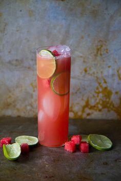 a tall glass filled with watermelon and lime