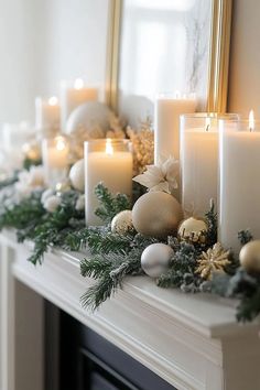 a mantle with candles and ornaments on it