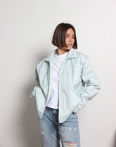 Vintage oversize Adidas 1990s bomber for women in light blue color. The type is windbreaker, so it's perfect for windy weather, whether it's spring, summer, or fall.  For sporty and stylish women. Perfectly matches with jeans, but as long as it's sporty style, it is a great idea to wear it for a stroll or jog with some sporty legging, shorts, or even a skirt too. Oversize Brand: Adidas Era: 1990s Size: XL Material: Polyester Measurements: - Chest: 124 cm / 48,8 inches - Length: 65 cm / 25,5 inch Trendy Spring Windbreaker For Streetwear, Trendy Spring Streetwear Windbreaker, Casual Spring Streetwear Windbreaker, Casual Spring Windbreaker Relaxed Fit, Casual Spring Windbreaker In Relaxed Fit, Casual Spring Windbreaker With Relaxed Fit, Relaxed Fit Outerwear For Spring Streetwear, Sporty Cotton Windbreaker For Spring, 90s Light Wash Outerwear For Streetwear