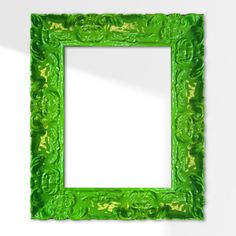 an ornate green frame on the wall with a white background and clipping area for text