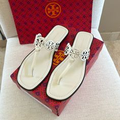 Tory Burch Tiny Miller Sandals In Ivory. Calf Leather With Leather Soles. Beautiful Elegant Sandals. Size 8. Have In Black Also On My Site. New With All Original Packaging. I Prefer These To The Original Miller’s, When Wanting To Elevate Your Look. White Classic Sandals With Single Toe Strap, Classic White Sandals With Single Toe Strap, Luxury White Sandals With Single Toe Strap, Classic White Sandals With Flat Heel, Classic White Flat Sandals, Luxury White Flat Heel Sandals, Luxury Cream Almond Toe Sandals, Chic White Sandals With Almond Toe, Elegant Off White Leather Sandals