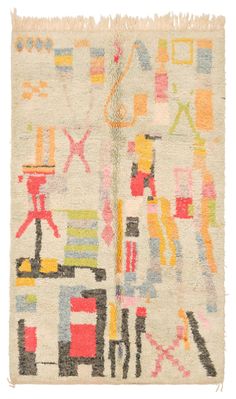 a multicolored rug with various shapes and sizes