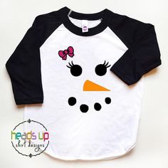 "Snowman Shirt. This adorable \"Snowman\" shirt is perfect for your little one. Could be used as a cute everyday shirt or for a holiday! It also makes a great gift! It is made using high quality heat transfer vinyl and comes on a white/black shirt. BOY VERSION Available as well as Other Designs! (Please see my other listings) https://www.etsy.com/shop/Headsupshirtdesigns?ref=seller-platform-mcnav&section_id=18569243 **SIZING** We use the American Apparel brand shirts. These shirts tend to ru Snowman Tshirt, Girl Snowman, Portrait Silhouette, Hipster Gifts, Sublimacion Ideas, Snowman Shirt, Cricket Ideas, Snowman Faces, Holiday Clothes