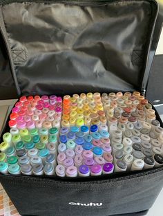 an open case filled with lots of different colored crayons in it's contents