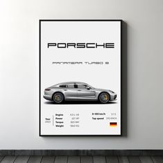 a porsche poster hanging on the wall