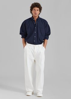 Color: NavyMidweight woven cotton fabric Oversized fitPointed collar Single chest pocketButton cuffsSlight high low hemCurved hemContrast front button closureUnlined100% CottonGentle Machine Wash or Dry CleanImportedOne Size Relaxed Fit Poplin Shirt With Button Cuffs, Relaxed Fit Cotton Shirt With Cuffed Sleeves, Cotton Shirt With Welt Pockets For Daywear, Oversized Cotton Shirt With Concealed Placket, Cotton Shirt With Relaxed Fit And Cuffed Sleeves, Formal Cotton Tops With Pockets, Classic Shirt With Pockets And Straight Hem, Classic Daywear Shirt With Pockets, Classic Shirt With Pockets For Daywear