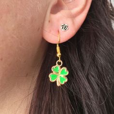 "Gold Shamrock earrings Four leaf clover jewelry Good Lucky clover jewelry  The four-leaf clover is an uncommon variation of the common, three-leaved clover. According to tradition, such leaves bring good luck to their finders. Each leaf is believed to represent something: the first is for faith, the second is for hope, the third is for love, and the fourth is for luck.A great gift idea for anyone you think might need some luck or a wish!  MEASUREMENTS: * Earrings 1 1/2\" (45mm) → MATERIALS: Gol Green Hypoallergenic Flower-shaped Earrings, Hypoallergenic Green Flower-shaped Earrings, Dainty Green Flower Earrings, Green Flower Shaped Earrings As Gift, Green Flower Shaped Earrings Gift, Green Flower-shaped Earrings As Gift, Green Flower Earrings As Gift, Gift Green Single Flower Earring, Gift Single Green Flower Earring