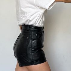 Pair your shirt with these high-waisted black leather shorts for a chic and modern look. Perfect for casual outings or a night out. Enjoy free shipping on all leather shorts Made from premium genuine leather Mini length for a stylish, contemporary appearance High-waist design enhances your silhouette Soft and comfortable lambskin leather Perfect for gym, casual wear, or summer activities Each pair is completed in approximately seven business days Step out in style with these stunning handcrafted Leather High-waisted Shorts With Belt Loops, High-waisted Leather Shorts With Belt Loops, Trendy Short Leather Bottoms, Trendy Leather Shorts, Trendy Short-length Leather Bottoms, Black Leather High-waisted Shorts, Chic Leather Shorts For Night Out, Edgy High-waisted Faux Leather Shorts, Chic Leather High-waisted Shorts