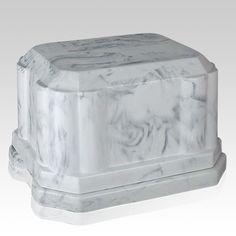 a white marble box sitting on top of a table