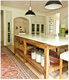 a large kitchen island with baskets on it