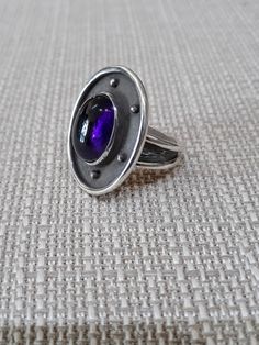 One of a kind amethyst and sterling silver ring. Size 8(free sizing with purchase). Modern Purple Rings With Polished Finish, Modern Sterling Silver Amethyst Ring With Polished Finish, Modern Purple Ring, Elegant Amethyst Cabochon Ring In Sterling Silver, Unique Amethyst Ring With Large Stone, Elegant Sterling Silver Cabochon Amethyst Ring, Elegant Sterling Silver Amethyst Cabochon Ring, Handmade Oval Amethyst Ring In Sterling Silver, Formal Sterling Silver Amethyst Open Ring