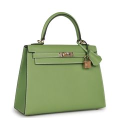 This Special Order Kelly, in the Sellier style, is in Vert Criquet epsom leather with permabrass hardware and has contrast stitching, two straps with front toggle closure, clochette with lock and two keys, single rolled handle and removable shoulder strap.The interior is lined with Vert Criquet chevre and has one zip pocket with an Hermes engraved pull and one open pocket on the opposite side. Collection: B Origin: FranceCondition: New and never worn (plastic on hardware)Accompanied by: Hermes box, Hermes dustbag, clochette, lock, two keys, shoulder strap, carebook dustbag, shoulder strap dustbag, rainhat, carebook and feltMeasurements: 10" width x 7.5" height x 4.5" depth; 2.75" handle drop (16.5" shoulder strap drop) Hermes Kelly Sellier, Kelly Sellier, Hermes Box, Hermes Bags, The Flash, Gold Hardware, Versace, Zip Pockets, Prada