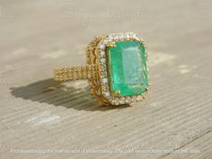 4.50 Carat Real Zambia Emerald And Diamond Engagement Ring - 14k Gold May Birthstone Gift Ring - Anniversary Wedding Ring - Emerald Ring GEMSTONE DETAILS : ✦ Gemstone : Natural Zambia Emerald ✦ Gemstone Size : 8.5 mm width / 12.5 mm length ✦ Gemstone Shape : Emerald Cut ✦ Number of Gemstones : 1 ✦ Gemstone Weight : 4.5 Carat ✦ Gemstone Grade : AAA DIAMOND DETAILS : ✦ Diamond Type : Natural ✦ Diamond Size : 2 mm and 1 mm ✦ Diamond Color : G-H ✦ Diamond Clarity : Slightly included ✦ Diamond Cut : Luxury 14k Gold Emerald Wedding Ring, Luxury Moissanite Emerald Wedding Ring, Gia Certified 14k Gold Cluster Ring For Wedding, Gia Certified Gold Diamond Wedding Ring, Luxury Hallmarked Emerald Wedding Ring, Dazzling Emerald Ring With Brilliant Cut For Wedding, Gia Certified Yellow Gold Diamond Ring For Wedding, Hallmarked Emerald Ring For Wedding, 14k Gold Emerald Ring With Center Stone For Wedding