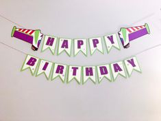 a happy birthday banner is hanging on the wall