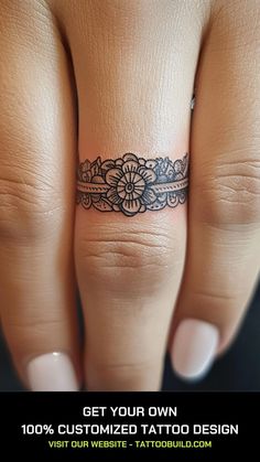 a woman's hand with a small tattoo on the middle finger that reads get your own 100 % customized tattoo design visit our website