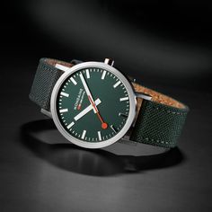 This Classic collection watch showcases a 40mm tone-on-tone stainless steel case, hands and markers with a matte finish to maintain the timeless design and minimalistic look of Mondaine. Featuring a Forest green dial and recycled PET textile strap with comfortable cork lining and stitches, this timepiece pays tribute to the beauty of our forests. Our Classic Collection comes with a clever quick-change system, allowing you to easily change your straps.SPECIFICATIONSFunction: Time Movement: Quartz Watch Green, Swiss Railways, Green Watch, Watch Companies, Classic Collection, Watch Collection, Watch Design, Stainless Steel Case, Forest Green