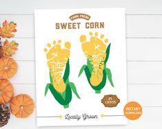 an image of a poster with the foot prints on it and pumpkins in the background