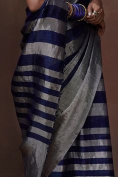 Midnight blue handwoven saree crafted in tissue base with silver toned awning stripes detailing. Comes with an unstitched blouse fabric. - Aza Fashions Saree Gowns, Dhoti Saree, Cotton Sarees Handloom, Lehenga Saree, Banarasi Sarees, Printed Sarees, Striped Fabrics, Handloom Saree, Blouse Fabric