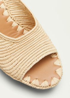 Carrie Forbes Aliyah Raffia Slide Sandals - Bergdorf Goodman Natural Straw Mules, Chic Beige Woven Mules, Beige Woven Straw Wedge Sandals, Natural Heels With Woven Sole, Natural Heels With Woven Sole For Vacation, Natural Straw Sandals With Block Heel, Straw Sandals With Block Heel In Natural Color, Natural Heels With Wooden Heel For Vacation, Beige Woven Straw Mules