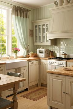 a kitchen with wooden floors and white cabinets, an oven, sink, microwave and window