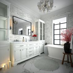 a bathroom with marble floors and white cabinets, chandelier above the bathtub