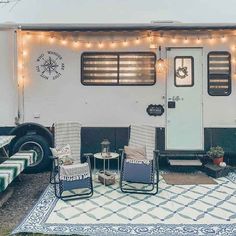 an rv is decorated with lights and chairs