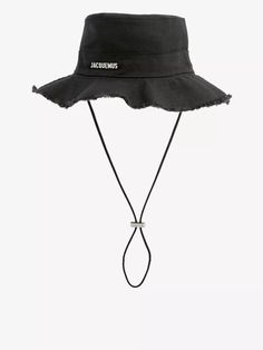 Hailing from the sun-drenched region of Provence, it's only natural that Simon Porte Jacquemus is something of an expert when it comes to hot weather-ready style. That's where pieces like the Le Bob Artichaut hat come in. It subverts the classic bucket shape by adding a hit of prairie-style with its raw edge floppy brim and drawstring tie at the base. Of course, it’s finished off with the French house’s metal plaque logo. Simon Porte Jacquemus, Cotton Bucket Hat, Prairie Style, French House, Metal Plaque, Raw Edge, Provence, Bucket Hat, Things To Come