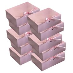 six pink gift boxes with ribbons tied around them