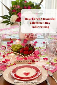 a valentine's day table setting with flowers and fruit